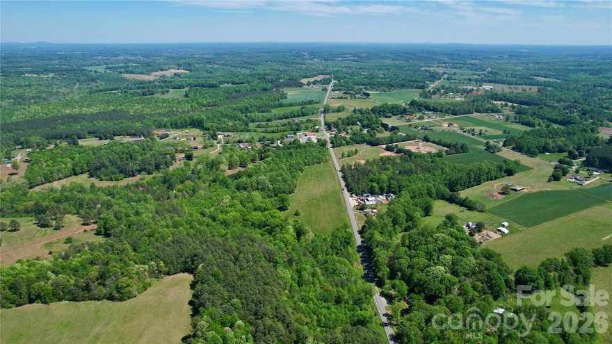 Over an acre in West Lincoln off Hwy 27 West. Offering a private setting with room to build and grow on a 1.02 acre lot. Water available along Hwy 27; taps required. Buildability to be confirmed with Lincoln County prior to closing. Plat map attached.