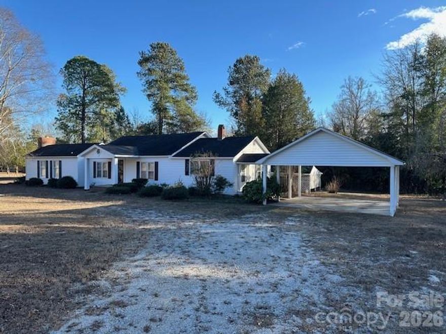 2073 John Munn Road in Bethune, SC offers the perfect blend of privacy and peaceful country living, set on 38.29 acres of beautiful land. This 1,728-square-foot home features 3 bedrooms, 2 bathrooms, a cozy wood-burning fireplace, and a convenient 2-car carport. The home reflects a classic interior design and has been thoughtfully updated, including new flooring in 2023 and a new HVAC system installed in 2025. The exterior was freshly painted in 2025, along with partial interior painting. A clear CL-100 report completed in February adds further peace of mind, making this home truly move-in ready. Whether you dream of gardening, hunting, or simply enjoying the quiet beauty of nature, this property offers endless possibilities across its expansive acreage.