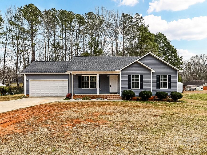 Don't miss out on this amazing opportunity! Hard to find, like new ranch style home located on a large .44-acre lot, with a two-car garage and No HOA. That's hard to find at this price point. The rocking chair front porch welcomes you as you enter the home to an open floorplan. Home features white cabinets and stainless-steel appliances, dining area and large family room with LVP flooring and neutral colors throughout.  You'll find a nicely sized primary suite with its own bath and walk-in closet and two more bedrooms, with a hall bath and laundry closet. Out back find a nice grilling deck with a large level lot with trees in the back and a firepit. Not too far from downtown Lancaster and the golf course. Don't wait to make this sweet home your own.