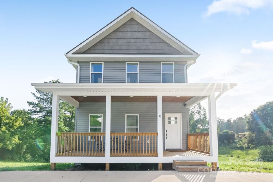 The Hidden Acre, a newer construction home on a sunlit, grassy acre just 15 minutes from downtown Asheville. The bright and airy open-concept main floor is designed for everyday living or entertaining with access to both a covered front porch and sunny back deck. A spacious living room with a cozy fireplace flows seamlessly into the dining area and kitchen. The kitchen boasts granite countertops, stainless LG appliances, center island with bar seating, and a pantry. Laundry room, including washer/dryer, conveniently located off the kitchen. Upstairs leads to the secondary bedrooms, a full bath, and a generous primary suite with ensuite bath and walk-in closet. The expansive walk-out basement—with 12-foot ceilings and plumbing for a bath—offers endless possibilities. Short-term rentals allowed, making this property equally appealing as a private residence, vacation home, or investment. Did I mention sunsets from the back deck? Peaceful setting, modern comfort, and room to grow—this is Asheville living at its best.