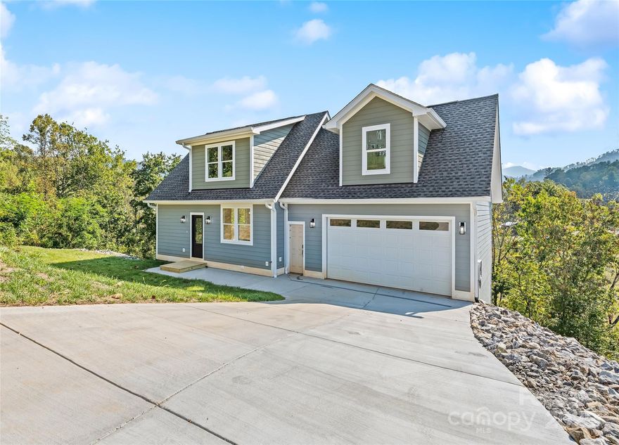 Stunning New Construction with Luxury Finishes & Mountain Views in Weaverville!
Welcome to your dream home in the heart of the Blue Ridge Mountains! This brand-new construction offers the perfect blend of high-end craftsmanship and thoughtful design, featuring 4 spacious bedrooms, including two luxurious primary suites, ideal for multigenerational living. Enjoy breathtaking mountain views from nearly every room, and an open-concept floor plan that flows seamlessly between living, dining, and kitchen areas. The gourmet kitchen boasts premium fixtures, shaker cabinetry, granite countertops, and a large island perfect for entertaining. Retreat to either of the two primary suites, each with a spa-like ensuite bath and generous walk-in closets. Located just minutes from downtown Weaverville and a short drive to Asheville, you’ll enjoy privacy, serenity, and convenience in one exceptional package. Don't miss this opportunity to own a luxury mountain retreat built with care and elegance!