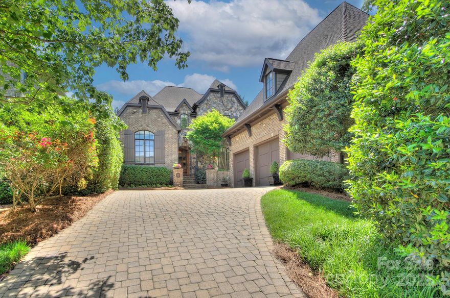 Beautifully crafted Arcadia home with a backyard so dreamy, even the flowers feel pampered! Fantastic floor plan with primary suite + dedicated office with soaring ceilings on the main level! Enjoy seamless flow through the open floor plan, complete with hardwood floors, elegant custom details such as coffered ceilings, heavy molding and French doors. Relax with your morning coffee in the breakfast nook, overlooking your lush gardens and your very own waterfall! Upstairs, three additional bedrooms, each with an en-suite bath plus a bonus room provide plenty of space for all! Step outside to what is sure to be your new favorite space! The covered back patio is the perfect spot to sit by the fire, catch the game or watch your favorite movie! After the show, take a dip and relax in your heated in-ground spa, surrounded by mature, low-maintenance, perfectly landscaped yard! Top it all off with a walk-in attic and a generous three-car garage! This custom-crafted dream checks all the boxes!