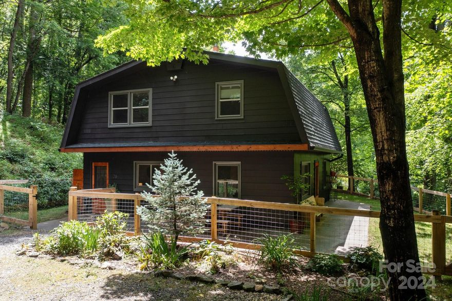 East Asheville modern farmhouse beautifully renovated in a Scandinavian style. Private and peaceful on one acre, yet close to all the city conveniences. Current owners have made many updates including the kitchen and bathrooms as well as flooring, lighting and fixtures, a wood-burning stove, a fenced-in yard and an outdoor shower! Great floor plan allows for a second living room upstairs, two bedrooms up and one on main - an excellent layout for working remotely. There’s a large storage shed/workshop and a detached carport and a fabulous rear deck and wrap-around patio. Lots to love in this quintessential Asheville oasis.