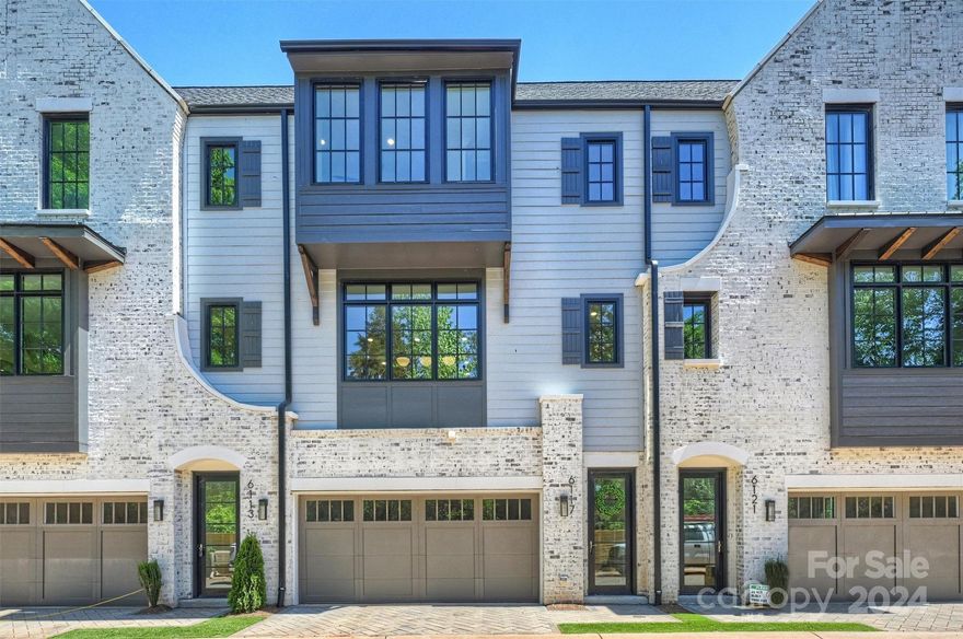 Nestled in the neighborhood of Strawberry Hill convenient to SouthPark sits this exceptional example of a modern tudor. The Towns at Berry Hill is a cutting-edge residential community in Charlotte's prestigious SouthPark area. Another fantastic project by Kinger Homes, this development consists 16 residences, each promising a harmonious blend of exceptional design. The pride of these homes is reflected in their well-appointed kitchens, equipped with luxury appliances, including a paneled cabinet Freezer/Fridge, a Wolf Gas Range, and complete with Wine Cooler, and more. Includes custom cabinet spaces throughout the home. Custom-built accent walls add to the overall feel and one of a kind design. Entertain seamlessly courtesy of the flowing open floorplan and allow the third floor bedroom layout to complete your home office setup. Enjoy the outdoors with private courtyards and balconies. Thoughtfully designed for easy parking and accessibility with two car garages on all homes.