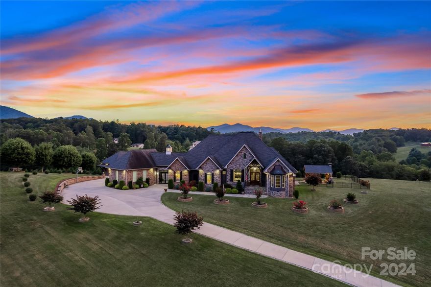 Exclusive gated estate offering an unparalleled blend of refined luxury! Located just minutes from downtown Asheville, you have the best of both worlds – the serenity of your mountain haven & the vibrant cultural offerings of the city at your fingertips. Nestled on a sprawling 2.71-acre expanse, this residence commands beautiful long-range mountain views that paint an ever-changing masterpiece across the horizon, paired with a captivating outdoor oasis for the ultimate relaxation & enjoyment. Inside you'll find a symphony of exquisite design and craftsmanship, with adorned high-end finishes & custom features weaving throughout every corner of this home. The exquisite kitchen blends elegance & functionality in perfect harmony.  
 The floor-to-ceiling stone fireplace that anchors the grand living space, exudes warmth & sophistication. The primary suite is a retreat fit for royalty. There's so much to discover here. Seize this opportunity to own a piece of Asheville's finest real estate.
