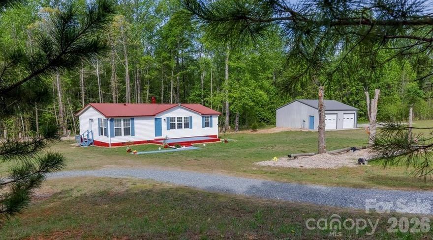 Welcome to your own private creekside homestead—a rare opportunity to own a fully updated home on 5.37 acres across two parcels, offering the perfect blend of comfort, functionality, and outdoor lifestyle.

Tucked away in a peaceful rural setting, this property immediately sets itself apart with a bold, flowing creek complete with a dedicated picnic and play area—an ideal space for relaxing, entertaining, or simply enjoying the natural surroundings. Much of the outdoor space is illuminated with solar lights for evening enjoyment and playtime.  Meandering walking trails and established fruit trees enhance the land, creating a true homestead experience.

The home has been thoughtfully and extensively updated, featuring a updated kitchen and bathrooms with high-end fixtures, new flooring throughout, fresh paint, and updated ceiling fans—delivering a clean, modern, move-in-ready interior.

A standout feature is the 900 sq ft insulated metal workshop/garage, fully equipped with electricity, and a large air compressor—perfect for hobbyists, contractors, or anyone needing a versatile, self-contained workspace.

The inclusion of two separate parcels (PINs 1623769 & 1623771) adds significant value and flexibility, offering potential for an additional homesite, resale, or long-term investment.

Whether you're looking for a mini-farm, private retreat, or functional live/work property, this one delivers a unique combination of upgrades, usable land, and lifestyle features that are hard to find in today’s market.