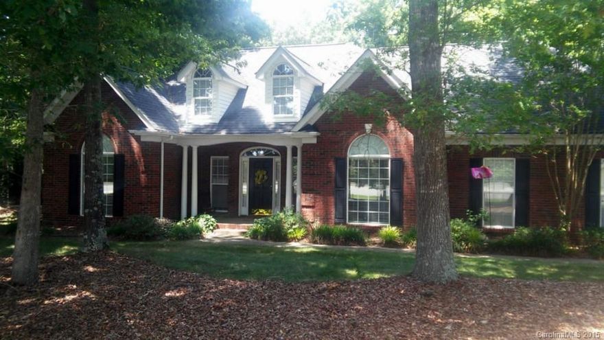 This Transitional beauty features large arched windows, round columns, covered porch, full brick veneer and open floor plan. Spacious foyer with ample closet space leads to the great room with cathedral ceiling and fireplace. The great room opens to the island kitchen with breakfast area and accesses a large deck with peaceful wooded surroundings. Trey ceiling in the master bedroom and dining room, with vaulted bedroom/study. The luxurious master bath features double vanity and separate shower.