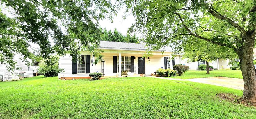 District 1 Schools!!  3 Bedroom 2 Bathroom one level Home in the Heart of Inman! Convenient to Inman, Spartanburg, I-26, Lyman, BMW, Greer, Landrum - you name it!  Home is located in well-established neighborhood, "Woods Creek", with mature landscaping, and a large welcoming front porch that is great for morning coffee or for bird watching!  Home has an open living & dining room, with the primary bedroom on one side and 2 bedrooms on the other. The primary bedroom has a full bath and large walk-in closet! The kitchen overlooks a patio and a very private backyard!! The owners planted Leland Cypress trees many years ago and they have grown up to create a wonderful privacy hedge!  Home has new LVT flooring.  The home is move-in ready, but it is also open to your new ideas and creativity!!  Call For Your Appt Today!!