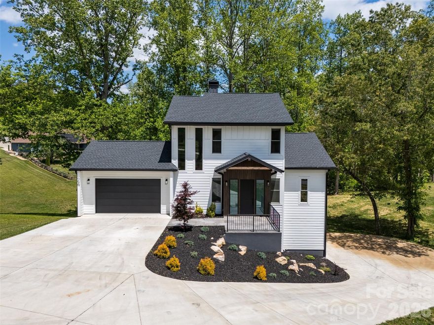 Located within a private, gated community, this residence offers an exceptional blend of security and tranquility. The property sits directly adjacent to a scenic pond, providing soothing water views from multiple vantage points throughout the home. Experience the ease of no-step entry into the main level. This thoughtfully designed, easy-flowing layout is perfect for those prioritizing accessibility and effortless movement. The walk-out basement is a true standout, functioning as a completely self-contained living suite including a garage, kitchen, laundry and a bedroom. This space is ideal for multi-generational living, or long-term guests.