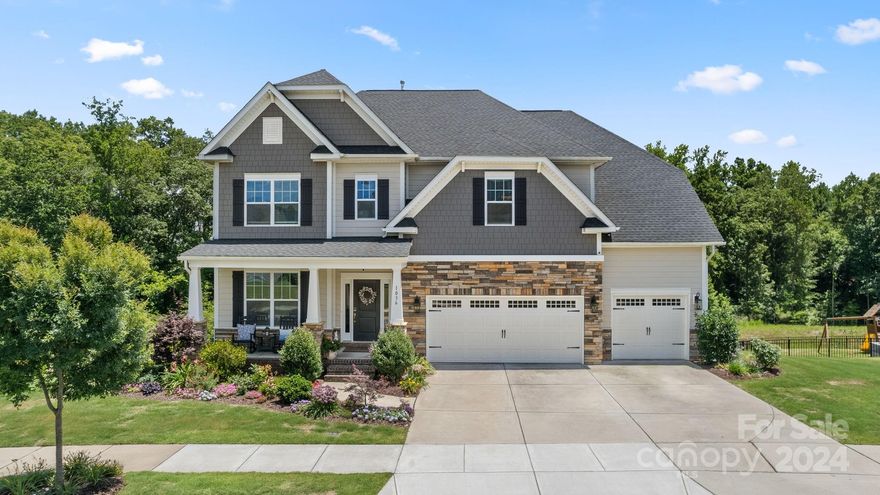 Amazing opportunity to own this beautiful 6-bedroom, 5 full-bath home in the coveted Massey community in Fort Mill. Enjoy the semi-private FENCED backyard with WOODED VIEWS and a walk-out FULLY FURNISHED BASEMENT already plumbed for a 2nd kitchen. The 3-CAR GARAGE and EXTRA DRIVEWAY SPACE is an added bonus! Enjoy your morning coffee on the large, covered deck, entertain on the patio, or enjoy the rocking chair front porch. This is a one-of-a-kind Dillion model. The community offers a clubhouse, exercise room, Olympic sized pool, lazy river, water slides and splash park! This one won't last long!