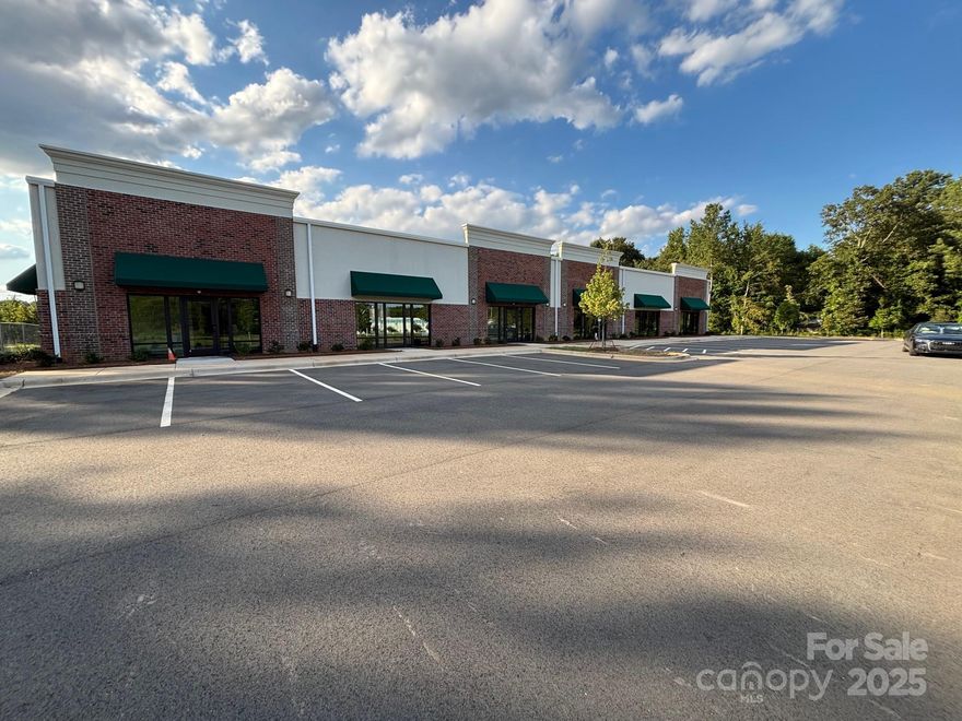 Brand New Building with over $750,000.00 worth of interior office build-out. Due to multiple[le delays, the tenant terminated their lease. We have received our corticate of occupancy Available for sale or lease. Attractive offices, break room, conference room and meeting space. 5,500 SF of warehouse with four dock doors and one drive in door. Ample parking. 6,500 SF of office space . All offices 100% heated and cooled with 25 tons of HVAC. Brand new Construction  12, 000 SF.? Located on Wesley Chapel Stouts Road a very heavily traffic Road between Sun Valley High school on Monroe Road and Lowe's on Highway 74 , Independence Road, the most travel road in North Carolina.? Close to I-485 which will take you to both I-85 and I-77.. Agent is one of the owners