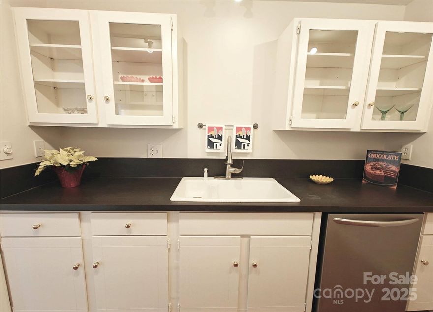 Move in ready in the heart of Myers Park! So convenient to all of central Charlotte, you’ll live among the beautiful oak trees only a stone’s throw from the Tiny Teeter, Squirrel Park & the iconic Duke Mansion + so many delicious restaurants & boutiques. This vintage condo has 2 full baths, solid wood flooring, nice big closets, glass door cabinets in kitchen, upgraded baths & freshly painted thru out. You’ll get your steps in as bldg wraps around the Myers Park Library & Opus condos. Unit is near laundry & stairwell. HOA assigns parking.  Note that Pets & short term rentals are not allowed. Charlotte House = easy living as HOA dues cover fast internet, cable TV, water/sewer, heat/A/C, trash/recycling, pool & common area maintenance/insurance/landscaping.  All you need to do is turn on the electricity.