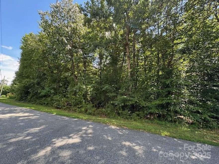 Stunning wooded .98 acre lot on Melrose Lane in Granite Falls.  Perfect for building your dream home or a peaceful getaway.  This prime location offers natural beauty, privacy, no HOA and has county water and sewer.  Close access to the boat ramp.