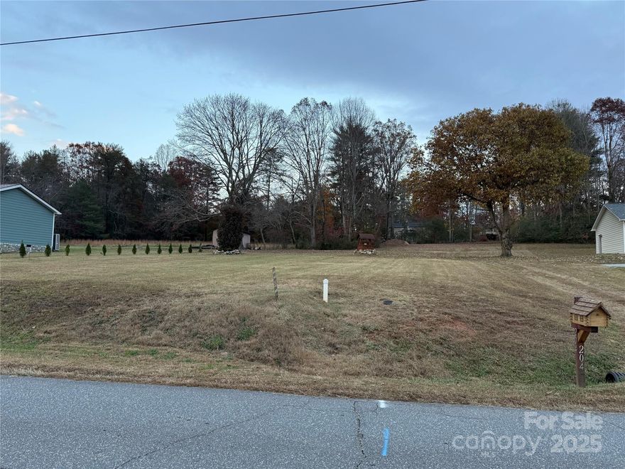 Ready-to-Build Lot in Morganton – Utilities On-Site! Survey Attached-This level, ready-to-build lot is just waiting for your final touches! Located within the city limits of Morganton, NC, you’ll enjoy the perfect blend of convenience and tranquility—only minutes from Downtown, yet set back enough to enjoy a peaceful, private setting.

Key Features:
City Water & Sewer already connected, Temporary Power and mailbox installed, NO HOA – enjoy your freedom! Log Cabin Mailbox adds a rustic charm right at the curb
Old Well on the property (condition unknown) Log home package available for purchase—a perfect opportunity to create your dream cabin. 
Don’t miss this chance to own a build-ready lot with all the essential infrastructure in place.