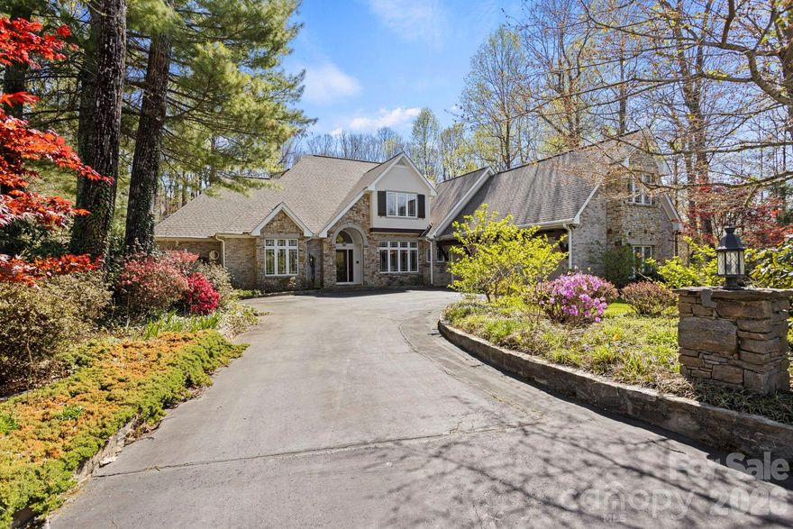 Stunning Estate Home in Prestigious Kenmure Golf Community. Experience luxury mountain living in this exceptional home located in the highly sought after Kenmure- a gated golf course community. Perfectly positioned on 1.3 private acres on a cul-de-sac, this beautifully designed 4-bedroom, 5 full bath, 2 half bath residence offers the ideal blend of elegance, comfort, and functionality—with space for every lifestyle need. From the moment you arrive, you'll appreciate the level driveway, welcoming entry and fully fenced backyard—ideal for pets, play, and outdoor enjoyment. Inside, the home showcases impressive architectural details, soaring vaulted ceilings, rich hardwood floors and thoughtful craftsmanship throughout. The main level centers around a breathtaking great room featuring cathedral ceilings with exposed beams, a dramatic wall of windows with Palladian window accents, custom built-ins, and a floor-to-ceiling stone fireplace—creating a warm and inviting setting for entertaining or relaxing. The chef’s kitchen is truly extraordinary, offering abundant cabinetry and counter space, premium stainless steel appliances, sub-zero refrigerator/freezer, oversized gas cooktop with griddle, custom exhaust hood and double wall ovens-both of these framed by stunning brickwork, center island with prep sink and breakfast bar, plus a Butler’s pantry/bar area with beverage refrigerator. The luxurious primary suite is a private retreat featuring vaulted beam ceilings, spa-inspired bath with garden tub, walk-in tiled shower with multiple shower heads, dual vanities, and two walk-in closets. Additional main-level highlights include: breakfast room and elegant dining room with tray ceilings, private den/study, spacious office area, huge laundry room with sink, cabinetry and workspace and two powder baths. Upstairs, guests and family will enjoy three additional bedrooms, three full baths, and a large bonus/flex room with closet. The lower level is designed for recreation and relaxation with: large family room with fireplace, wet bar area, billiards/game room, full bath and two expansive storage/workshop areas. Outdoor living is equally impressive with a screened porch, open deck, lower patio/deck, and hot tub, all overlooking the beautifully landscaped fenced yard. Additional features include a two-car plus golf cart garage, newer roof and a prime location convenient to Kenmure’s amenities and gate access. This remarkable property offers a rare opportunity to own a luxury mountain home with unmatched space, style, and versatility.