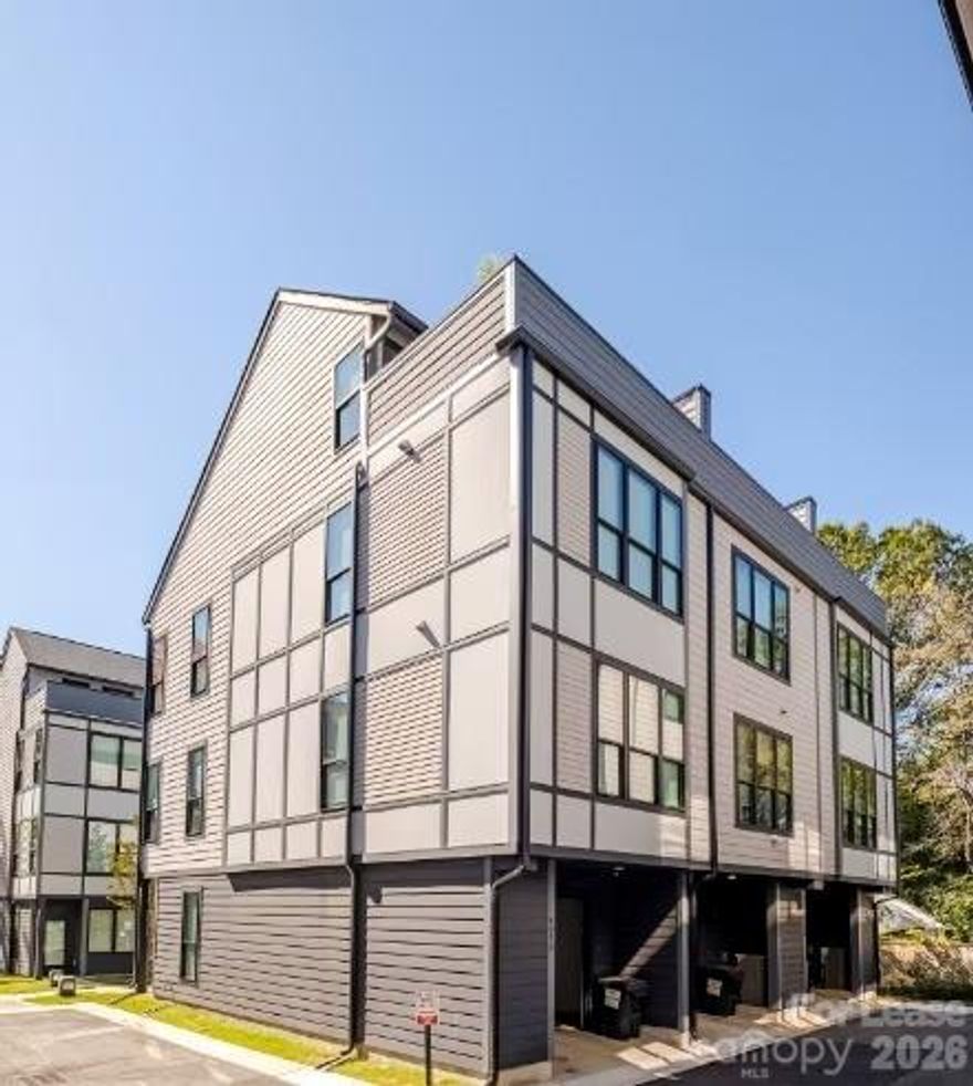 Stunning end-unit townhome in Charlotte’s South End featuring modern design and upscale finishes. Available unfurnished at 3,850/month. Furnished is an option at an additional price per month. Shorter terms considered. Light-filled open floor plan with smart LG TV and SONOS surround sound. Gourmet kitchen with modern appliances, waterfall kitchen island, espresso/latte maker, cocktail bar, and dining space for 6–8. Primary suite with king bed, en-suite bath, and walk-in closet with custom built-ins. Two additional bedrooms with private en-suite baths. Fourth-floor office opens to rooftop deck with skyline views. 
Home is equipped with Norman roller shades throughout. Additional features include SimpliSafe smart locks, doorbell camera, security system, high-speed Wi-Fi, LG stackable washer/dryer, secure tandem garage parking, and ample street parking. Convenient to Uptown, SouthPark, Bank of America Stadium, Mint Museum, and LoSo. Furnished option is professionally designed and includes designer furnishings from West Elm, Casterly, and CB2, along with utilities.