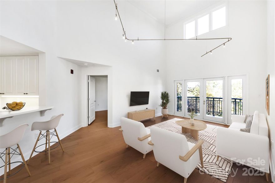 Motivated seller!  Stunning Top-Floor Condo in Prime Uptown Charlotte Location. This exceptional two-story condo features soaring 20-foot ceilings, expansive windows, and an open-concept layout that’s perfect for modern living. The split-bedroom floor plan offers privacy and comfort, while recent updates—including new hardwood flooring throughout and a brand-new HVAC system (2025)—make this home move-in ready. Located in a sought-after building that offers amenities, including a fitness room and a warm, inviting courtyard—perfect for relaxing or socializing. Enjoy walkable access to everything Uptown Charlotte has to offer: top-tier restaurants, sports venues, concerts, theaters, art galleries, and more. Just one block from Fourth Ward Park and a few blocks from Harris Teeter grocery store. A rare opportunity to own a stylish, light-filled condo in the heart of the city!