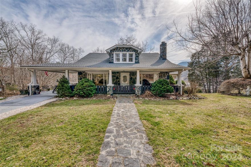 Don't miss out on this remarkable home located right in the heart of Spruce Pine! This home is nestled on a generous size corner lot less than half a mile from 19E and minutes from downtown Spruce Pine and shopping. As you come onto the property, enjoy the covered attached carport and front porch or meander to the over-sized, wrap around porch with the beautifully added bar area, overlooking the expansive and beautiful backyard with peaceful and serene mountain views. As you step inside, let the atmosphere of home set in as you enjoy the 5 bedrooms, 3 baths at 2,500 square feet of heated living space. Then step into expansive, unfinished basement and out onto the stoned back patio offering another built in bar area and built in fire pit. As you explore the backyard, you will discover a large shed/outbuilding and a nice sized above ground pool. Come make a visit today and don't miss out on this opportunity! **FIREPLACE IS INOPERABLE - WAS OPERABLE WHEN SELLER PURCHASED BUT HAS REMOVED**