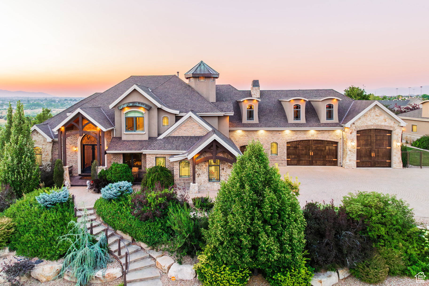 *****MOTIVATED SELLER***** Timeless, palatial two-story estate located in the heart of Draper and Utah's Silicon Slopes. From the moment you arrive, you'll be captivated by the stunning curb appeal and the grandeur of this magnificent home. Stepping inside, you're greeted by an impressive entryway - truly one of the grandest you will ever see. Just off the front door, a beautiful office features rich tiger wood details throughout, creating an elegant and inspiring workspace. The home offers main-floor living and showcases timeless design elements, including formal living and dining rooms that are increasingly rare today. There are ample options for placing a piano, allowing you to create the perfect setting for gatherings and music. Step out the back door into an entertainer's paradise, where you'll find a sparkling saltwater pool with a slide, a charming gazebo, a cozy fire pit, a playground, an in-ground trampoline, and a fully equipped outdoor kitchen - everything you need for unforgettable summer parties. Upstairs, you'll find three spacious bedrooms and an open office area, ideal for homework, a second office, or a creative space. The lower level features three additional bedrooms, a second kitchen, an expansive family/game room, a luxurious home theater, a large safe room with a secure door under the porch, and a substantial unfinished space that can be customized as a gym, pickleball court, or basketball court. Above the main garage is a private studio apartment with its own separate access through the garage - perfect for guests or extended family. To the right of the home is an extraordinary detached garage, large enough to accommodate 1214 additional cars. These garages are outfitted with heaters, epoxy floors, and 220V power. Above the detached garage, you'll find a beautifully finished three-bedroom apartment with high-end finishes consistent with the rest of the home. This home is perfect for someone that wants to run their business from their home, with plenty of room for inventory and parking. No matter what you're looking for, this estate offers it all - luxury, space, versatility, and unparalleled amenities. *****SELLER WILL CONSIDER SELLER FINANCING WITH A MINIMUM OF 25% DOWN*****