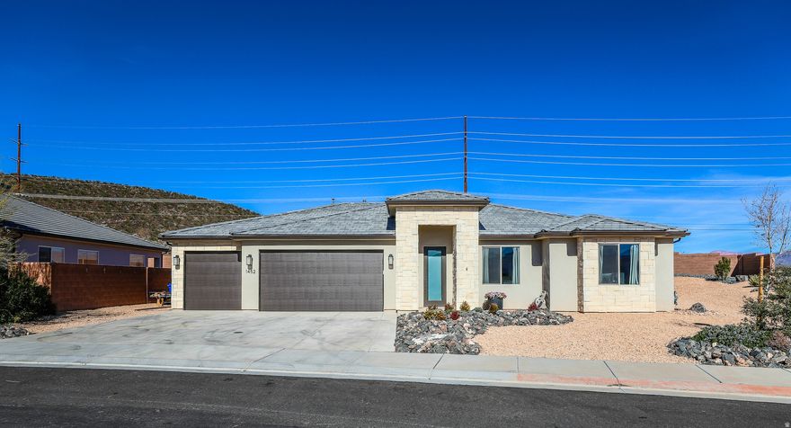 Barely lived in and beautifully maintained, this Painted Sands home offers 4 bedrooms, 2 baths, and a spacious 4-car garage-perfect for vehicles, storage, or toys. Enjoy quartz countertops throughout, soft-close cabinetry, and upgraded flooring. Nestled on a large corner lot with a private backyard, this home features a great floor plan and so much more to love.