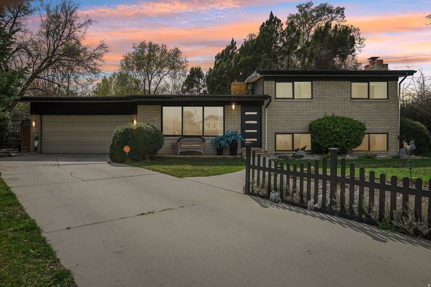 Walk through the door and leave the city behind. Tucked within a quiet cul-de-sac, this custom cottage offers a rare blend of charm, privacy, and accessibility-your own hidden woodland retreat in the heart of the valley, just 15 minutes from nearly everything and 5 minutes to freeway access. This beautifully maintained all-brick home sits on a spacious lot surrounded by mature trees, creating a peaceful, secluded setting. The fairytale backyard has raised garden beds, a chicken run, multiple patios, a tree slide, and a fire pit-ideal for gathering under the trees with twinkling lights overhead. Inside, warm tones and rich textures create inviting living spaces. A large picture window fills the living room with natural light, while hardwood floors add character and continuity. The updated kitchen features granite countertops and stainless-steel appliances. The lower level offers a spacious second family room anchored by a striking stone fireplace, with convenient walk-out access to the backyard.  A neighborhood group text helps residents stay connected and fosters a sense of community.