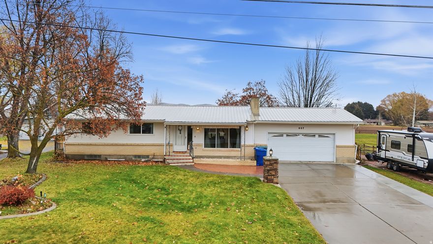 Great home on a huge city lot! Tons of updates and work done to home to make it a must see.  There is a covered patio and a deck to enjoy the extra large back fully landscaped yard with a sprinkler system and mature trees. The location is also a plus to this home and you feel like you are on your own. Seller has plans for a shop he was going to build that they will leave.