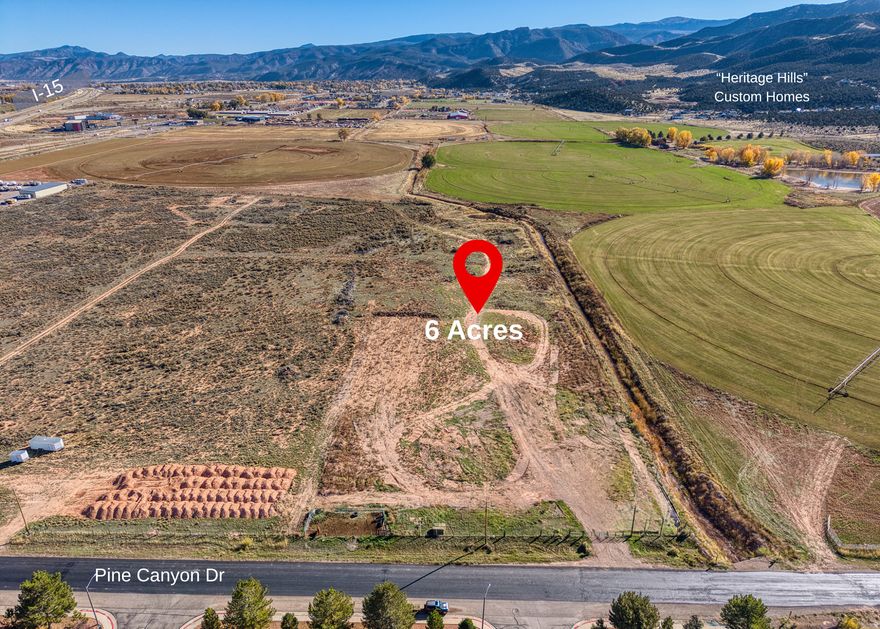 7.13-Acre Gateway Commercial Opportunity located at Parowan's first exit near I-15, the new Maverik, & Valor Hotel. Positioned as a great winter access route to Brian Head, this high-visibility site captures consistent year-round traffic from tourists, recreationists, & regional travelers-ideal for hospitality, mixed-use, or destination-driven development. The property is fully supported by city utilities, including water (1 acre-ft per building permit), city sewer, natural gas, power, and high-speed fiber internet with capacity for up to 350 units. The rear of the parcel borders open farmland, offering scenic stability. Seller included an additional 1.13-acre parcel with a full-price offer, effectively providing 7.13 acres for the price of 6.
