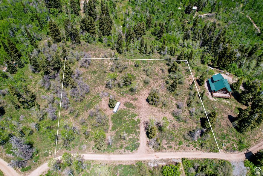Perched at the top of Tollgate Canyon, this pristine 2-acre lot offers the perfect balance of breathtaking panoramic views and tranquil seclusion among the pines. Ready for immediate enjoyment with a completed driveway and water connection, this year-round accessible property awaits your dream cabin to be built or pull your recreation vehicle up to enjoy all this serene mountain setting has to offer.   Just 20 minutes from Kimball Junction and 35 minutes from Main Street Park City, this premier location in the established cabin community of Tollgate Canyon lets you escape to nature without sacrificing convenience. Experience the serenity of mountain living while keeping Park City's world-class amenities and attractions within easy reach.  Your mountain sanctuary awaits-where peaceful seclusion meets accessible adventure.