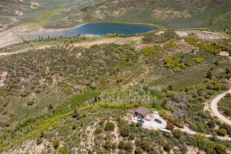 Discover the perfect seasonal escape with this charming 3-bedroom, 1-bath cabin tucked away on a private, gated road and backing directly to U.S. Forest Service land. Offering stunning, unobstructed views and unmatched privacy, this unique property is ideal for those seeking a true mountain retreat. Enjoy endless recreational opportunities right from your doorstep-hiking, wildlife watching, and access to miles of public land. The cabin's serene setting makes it an ideal getaway from the hustle and bustle of everyday life. Key Features: 3 cozy bedrooms, 1 full bath Backs to Forest Service land-no rear neighbors ever Panoramic, unobstructed views of surrounding wilderness Private road with gated entry for added security Seasonal access only-winter access by snowmobile Not permitted for full-time residency If you're looking for a private and peaceful hideaway immersed in nature, this one-of-a-kind cabin is the perfect fit. This property is off the grid. There is a spring in the community that water can be hauled from. Right now the cost of the water is $50.00 per year. This is not zoned for permanent residency. The only access to the cabin in the winter is by snowmobile or snowcat. The county does not maintain the roads in the winter. Square footage figures are provided as a courtesy estimate only and were obtained from the county. Buyer is advised to obtain an independent measurement.