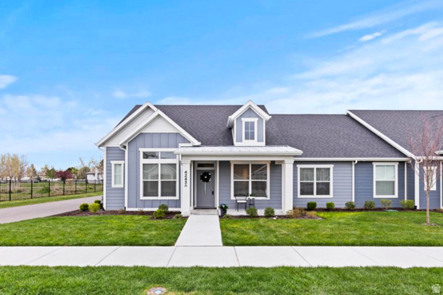 You will fall in love with this end unit Patio Home! Amazing view of the Wasatch front. This home has a gorgeous large white kitchen and a large master suite on main floor. There is a large bonus room upstairs that has a closet, and a window so can be used as a bedroom or a great room, it also has its own mini split system for cooling. This home also has a guest room and an office on main floor and 2-car garage. Close by are 7 miles of walking trails, pickle ball courts, playgrounds, stocked fishpond and lots of open space. Such a great place to live, close to but far enough away from everything you need.