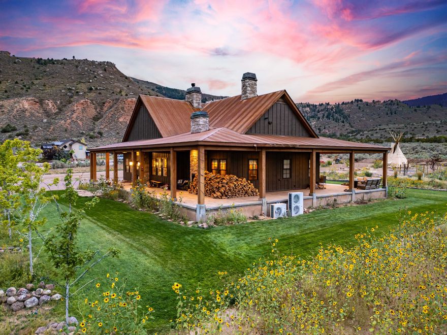 Welcome to the iconic Wolf-Raven Ridge. Inspired by the timeless architecture of Jackson Hole, this Dry Fork Canyon estate is more than a home-it's an experience. From the moment you enter Dry Fork Canyon, there's a sense you've arrived somewhere extraordinary, where mountain air mixes with the scent of pine and the views open wide to the Sawtooth backdrop with wilderness stretching out in every direction, surrounded by the vastness of National Forest and BLM lands. Set on over eight acres, the property blends privacy and freedom with a level of craftsmanship and detail that can only come from a fully custom build. The approach begins at the covered porch framed by Amish-crafted timbers, and inside you're welcomed by soaring 20-foot vaulted ceilings, knotty alder beams and cabinetry, and fireplaces anchored with stones hand-selected from Ashley National Forest. Every space has been designed not just to impress but to create moments of connection and comfort, from the chef's kitchen with Sub-Zero fridge, Caf Series appliances, custom copper-trimmed hood, hidden walk-in pantry, and pine tongue and groove accents, to the subtle glow of hidden lighting and the discovery of a secret bookcase hutch. The master suite is its own retreat with a freestanding tub, steam shower, and custom built-ins, while the home's systems quietly deliver efficiency and reliability with dual heat pumps, 95%+ furnaces, tankless water, and a 1,000-gallon propane supply. Step outside to a stamped patio for evenings under the stars, a 2,000 square foot insulated shop with pass-through garage doors, and grounds that include horse facilities, a chicken cabin, gardens, and groomed walking trails. Wolf-Raven Ridge is a property that makes a statement yet feels deeply personal-crafted with integrity, rooted in vision, and set in a location that simply cannot be replicated. Nothing like it has ever been offered in the Uinta Basin, and nothing else will capture your imagination in quite the same way.