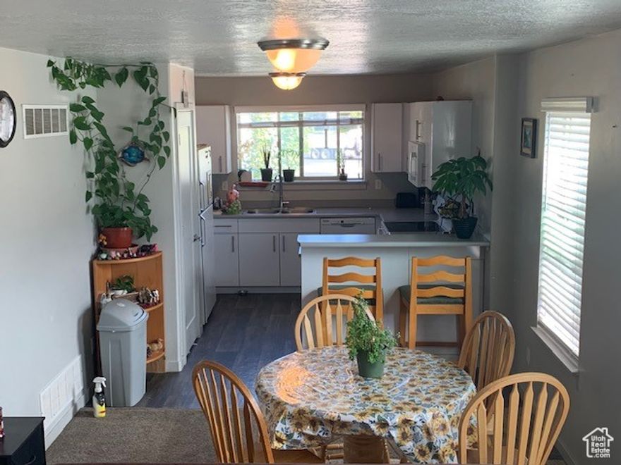 Welcome to this beautifully maintained 2-bedroom, 1-bathroom condominium located in the desirable Flying Horse subdivision in Orem, Utah. This inviting home offers a perfect blend of comfort and convenience, making it ideal for first-time buyers, downsizers, or investors. Inside, you'll find a spacious and bright living area with large windows that let in plenty of natural light. The seller is willing to paint the unit and allow some credit for carpet. Washer and dryer not included. This 2 bed, 1 bath condominium is conveniently located near freeway access, near by parks, shopping  centers, and top rated schools. All information deemed reliable but not guaranteed. Buyer verify all. HOA subject to change. Buyer/BA should confirm the current fees and understand any community rules and restrictions.