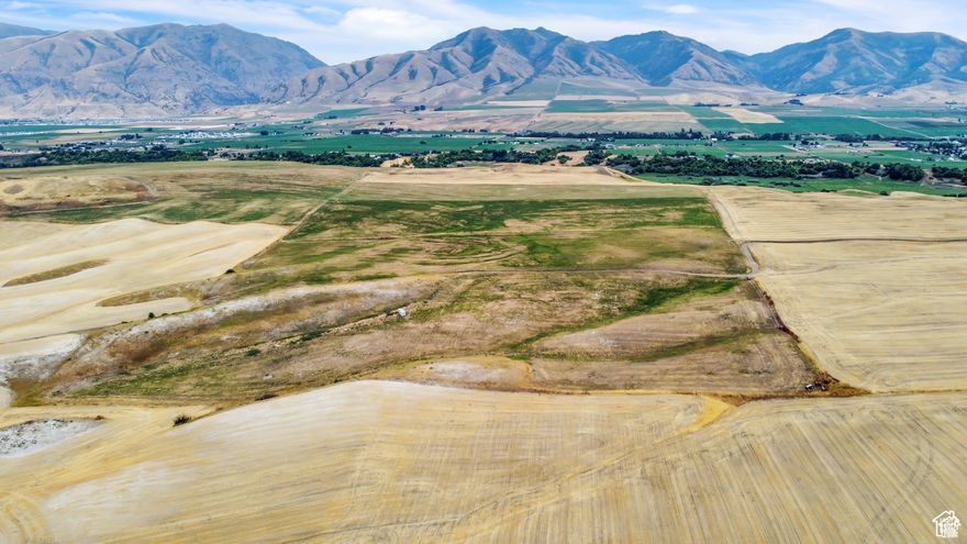 7.26 Agricultural land with amazing views of the surrounding mountains and valley. The land is currently in a Greenbelt status.