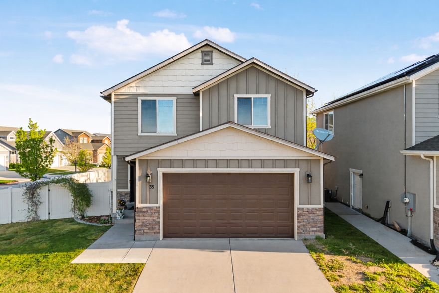 Beautifully updated single-family home in the desirable Gardens neighborhood of Vineyard-offering the rare advantage of no HOA while still being right next to the highly amenitized Waters Edge community. Situated on a corner lot with ample parking and a south-facing driveway for quicker snow melt, this home checks all the boxes for comfort and convenience. Inside, you'll find a thoughtfully updated kitchen featuring ample refreshed cabinets with soft close doors and drawers throughout kitchen, countertops, and flooring, along with a gas stove and a gas line to the backyard patio-perfect for grilling and entertaining. The spacious primary suite has been remodeled to expand the bedroom and enhance the bathroom with space for a freestanding garden tub, creating a true retreat. With 4 bedrooms total (3 of which include ensuite bathrooms) this layout offers flexibility for a large family, singles wanting privacy and space with roommates, or multi-generational living. The fully finished basement adds even more usable space, while upgrades like a new water heater and included water softener provide added value. Step outside to enjoy the included hot tub, making the backyard a great place to relax year-round.