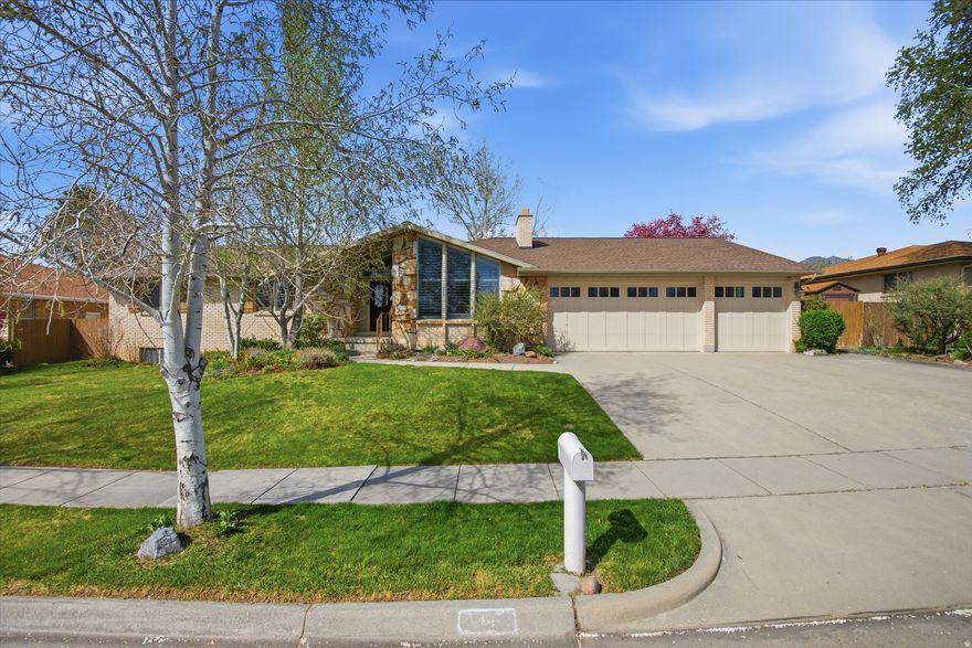 Spacious Millcreek rambler near canyon access and outdoor recreation. Main-floor living with a primary suite and a spacious lower level with kitchenette, and dual laundry-ideal for multi-generational living. Bright, open layout with mountain views. Extra-deep 3-car garage (32'10") plus 9'8" east-side parking-perfect for vehicles, gear, or a workshop. Close to trails, schools, and amenities!