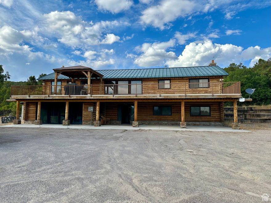 Discover the perfect getaway where memories are made in every season. This inviting log cabin sits on a combined 6.56 acres (including Parcel #40271, a vacant 3.56-acre lot), offering space, privacy, and endless adventure.  Enjoy morning coffee or sunsets on the spacious deck, surrounded by nature and visiting hummingbirds. Large picture windows bring the outdoors in, filling the family room with light and wildlife views.  Outdoor activities abound-ride 4-wheelers, go sledding in the winter, play horseshoes, or gather around the fire pit to roast marshmallows under the stars. Skyline Drive is only minutes away and famous for its outdoor recreation, including snowmobiling. Inside, multiple game tables provide year-round entertainment.  This home comes fully furnished and move-in ready, with recent chinking for added durability. A large storage container, two propane tanks (one owned, one rented-both recently filled), and a beautiful log-cabin aesthetic make this property both practical and charming.  Whether you're looking for a vacation escape, an investment property, or a year-round residence, this log cabin offers it all.