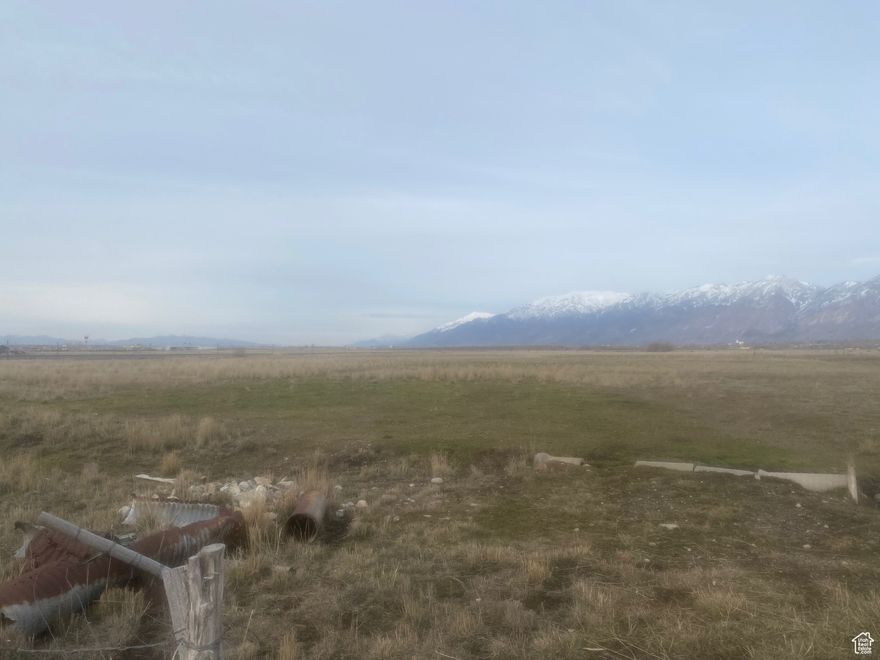 This sale also includes tax ID numbers 03-157-0156 which is 6.46 and tax ID number 03-157-0124 which is 12.72 acres.   Taxes shown are for all three properties but are based on green belt taxes.   Seller would consider selling individual parcels.   This has a ton of possibilities and could make an excellent development piece.  Utilities are in 2200 South.  There is also plenty of water for this property as well.