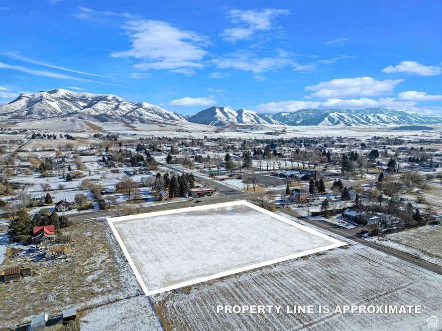 In the Heart of Paradise!  Considered "Center and Main", this terrific piece of land has a Very Bright Future - Frontage along the Main Road with City Services and Pressurized Irrigation, Zoning allows for General Commercial OR Residential with Large Animal Rights.  Come and See why they call it "PARADISE'!!