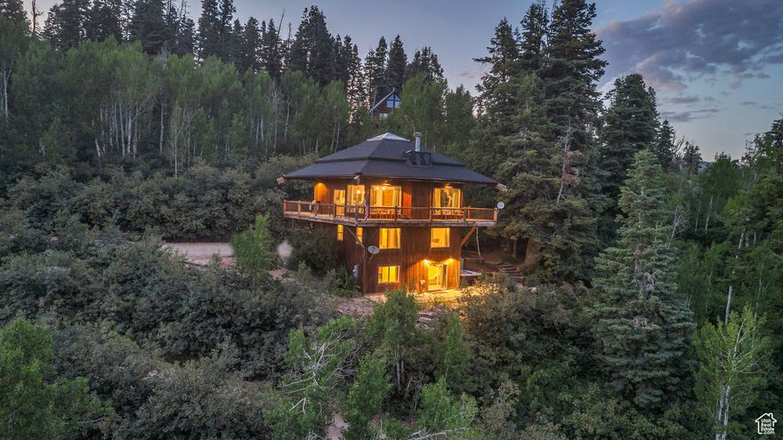 PRICE REDUCED! This Tollgate Tower residence presents an exceptional opportunity for use as a weekend retreat, a full-time residence, or a potential investment property for nightly rentals. The property features abundant natural light, enhanced by oversized windows that invite the morning sun into the meticulously maintained open main floor. Characterized by stately timbers and solid pine wood flooring, along with a substantial skylight, this home offers a welcoming and sophisticated ambiance. Key features include a vintage copper farm sink, a granite-topped island, a striking wood-burning or propane fireplace, and a suite of newly installed stainless steel appliances. Additional enhancements consist of a bonus covered wrap-around deck and a private patio that features a hot tub, creating an ideal environment for relaxation and entertainment. The residence is designed to evoke the experience of an annual mountain vacation, delivering a comprehensive package for an entertainer's dream. With spacious bedrooms and custom-appointed bathrooms, the property further emphasizes its appeal. The home is offered fully furnished, turn-key, and ready for you. Home is currently on VRBO-clients must respect the booking calendar for showings