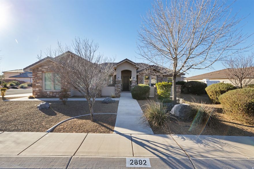 Adventure meets comfort in this beautiful 3-bedroom, 3-bath home in the highly sought-after Dixie Springs neighborhood. Located just minutes from Sand Hollow Reservoir, Sand Hollow Resort & Golf Course, Jellystone RV & Water Park, and miles of side-by-side trails, this home offers the best of Southern Utah living. Lightly used as a second home, it feels brand new and has been meticulously cared for. Large windows fill the space with warm natural light, creating a cozy, inviting atmosphere. Enjoy an open, functional layout with a private casita for guests, a 3-car garage with room for toys, and a like-new hot tub to relax under the stars. *Home cannot be occupied until June 1, 2026.*