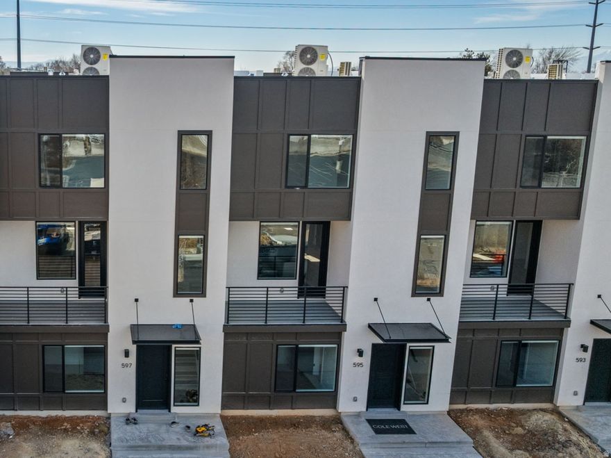 Experience modern, low-maintenance living at theMonroe, a thoughtfully designed townhome community in Salt Lake City's desirable Millcreek neighborhood. This Type C interior unit offers approximately 1,533 sq ft with 2 bedrooms and 2.5 bathrooms across three well-designed levels. The open-concept main floor features a stylish kitchen, dining, and living area that opens to a private balcony, ideal for everyday living or entertaining. Designer-curated finishes include 9' ceilings, quartz countertops, 42" upper cabinets, LVT flooring in main living areas, stainless steel appliances, and included washer, dryer, and refrigerator. The home also features an attached 2-car garage and flexible entry-level space. Community amenities include pickleball courts, a playground, a gathering center, and a dog park, offering both recreation and connection. Conveniently located near shopping, dining, TRAX/light rail, and major commuter routes. Schedule your tour today and discover refined townhome living at theMonroe.