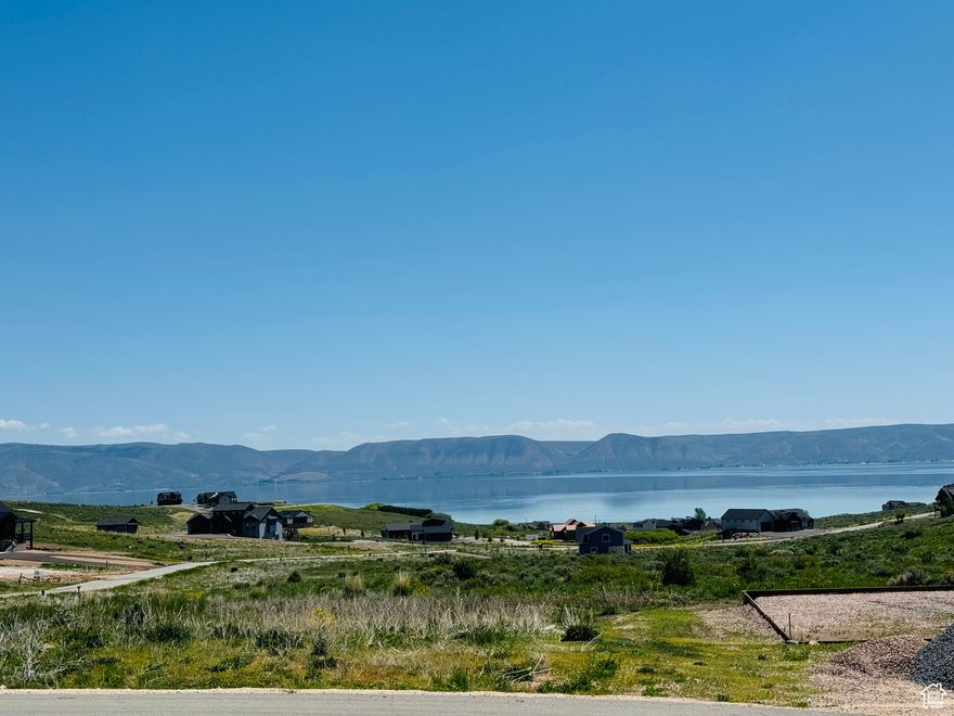 Spacious building lot with fantastic views.This beautiful gated community offers panoramic views of Bear lake and surrounding mountains, paved roads and private beach access. This is a very popular short term rental area with on site amenities which  include: two pools, splash pad, sports courts and much more. Dont miss out on owning this fantastic building lot!