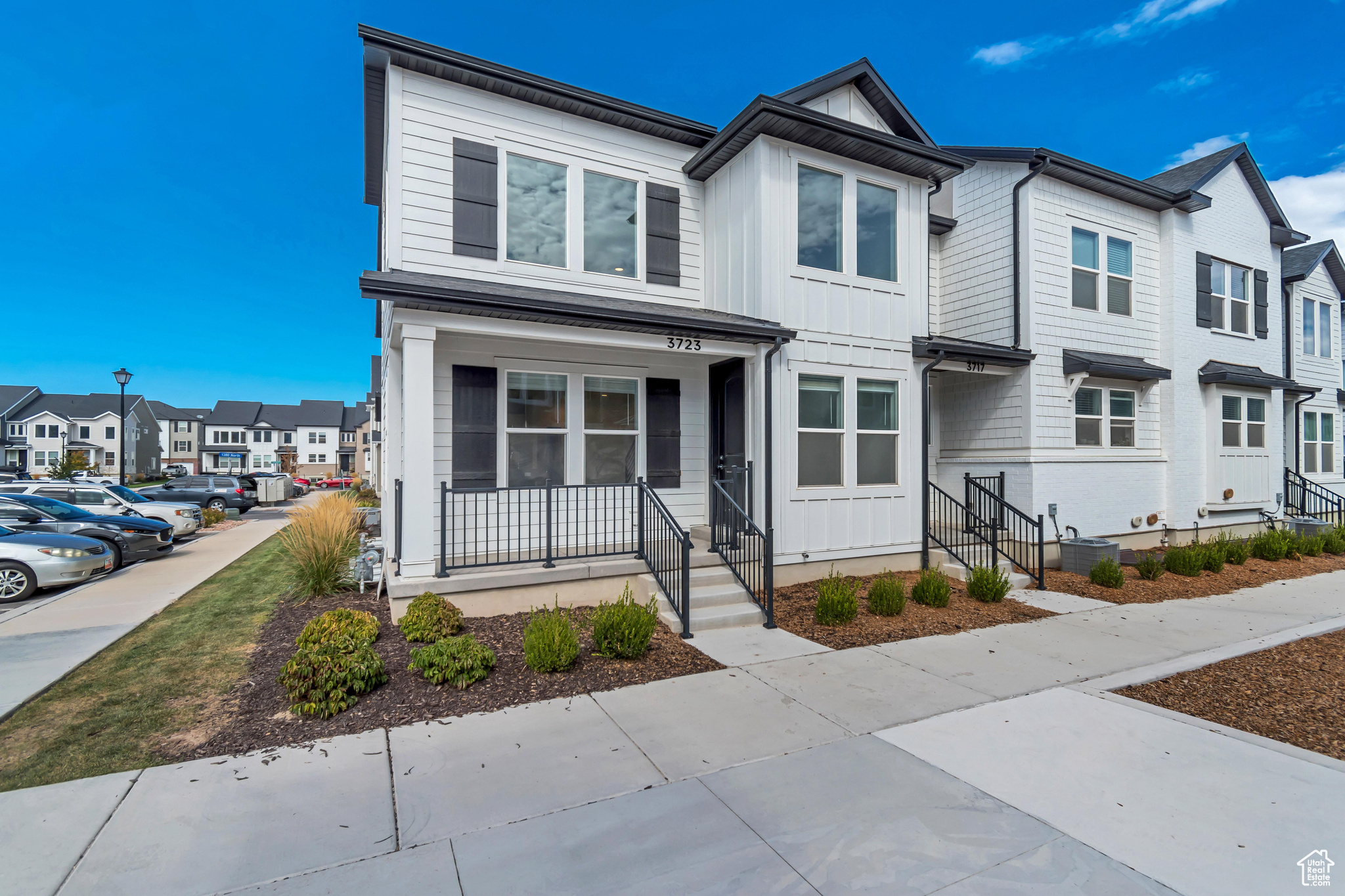 This beautiful townhome is an end unit directly adjacent to green space and a park. The unit itself features high end finishes such as quartz countertops, engineered wood flooring throughout entire main level, upgraded cabinets & lighting throughout, and vaulted ceilings in the primary suite and a two-story family room. EV charger in the garage as well! Washer, Dryer, Refrigerator, and a water softener are all included in the purchase price. Photos don't do this home justice, call for a private showing!