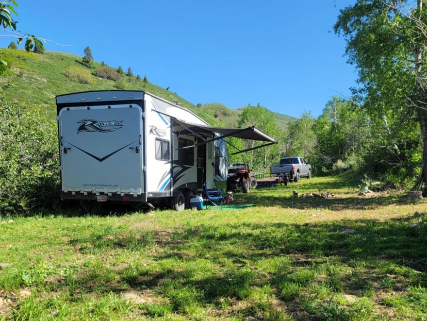 This beautiful 1.31 acres lot could be yours.  This Mountain get-a-way has a circular driveway (so no backing up your RV) with RV pad, septic system and fire pit area and within walking distance from the middle fork stream.  Tucked into the trees with easy access from the road makes this lot perfect for your summer camping.   Culinary drinking water is available year round on the lot.  This lot has amazing mountain and sunset views with tons of wildlife at every turn.  This is a fantastic get-a-way to escape the summer crowds and city noises.  Isn't it about time you had a dedicated camping spot that you did not have to reserve?  Moose lake is a couple of miles up the road with private fishing (no license required) and endless views.  It is going to be a long hot summer, so make sure you get to the mountains and enjoy it!    Lot is accessible all summer long and by snow machine in the winter.  Must obtain key from agent as you will have to get through 2 locked gates to access the community.