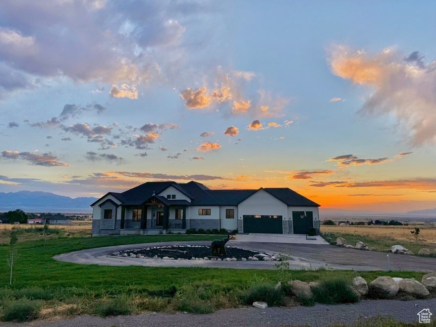 Seller Financing Available! Stunning Custom Home with Unmatched Views in Utah! *This one-of-a-kind, fully custom rambler offers the best sunset views in Utah with breathtaking 360-degree scenic vistas! *Prime Location: 4.7 acres in the sought-after Ranch at the Pine community, 25 minutes to the airport, 30 minutes to downtown Salt Lake City. Newly installed sprinklers and fresh grass in the front yard *Home Features: 5189 SQFT rambler with soaring 20 ft high ceilings, Spacious open concept with high-end custom cabinets and rare Crystal Quartz countertops, Unfinished basement already roughed-in, giving you a blank canvas to design as you like, Massive deck perfect for weddings or large gatherings, with spectacular views from both the main floor and basement   *Luxury Upgrades: Kitchen with TWO dishwashers  once you try it, you'll never go back Master suite with a huge walk-in closet that includes a private washer and dryer. Doggy shower, mudroom, and laundry room for added convenience. *Outdoor Space: 3/4 fenced property with room to expand. Unique Giant Elephant statue out front  said to bring good luck! High-speed internet, culinary water, and endless potential await in this exceptional home.