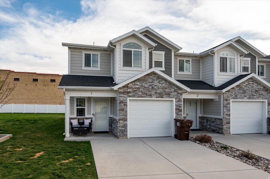 Welcome home to this beautifully maintained 1,362 sq ft end-unit in the heart of North Ogden. As the first unit in the development, you'll enjoy added privacy and direct access to a large, open grassy space-perfect for recreation, relaxing, or entertaining.  Inside, you'll find stylish LVP flooring and a bright, functional layout featuring three spacious bedrooms and 2.5 bathrooms. The kitchen is both practical and inviting, complete with granite countertops, a full pantry, a new smart dishwasher, and a new  horsepower disposal. New wood blinds throughout add a fresh, modern touch. Perfectly situated within walking distance to shopping, restaurants, parks, and trails-and just minutes from the interstate-this home offers both convenience and comfort in one exceptional package.