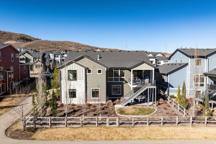 Located in the desirable Park City Heights community, this thoughtfully designed home offers modern mountain living with exceptional convenience. The six-bedroom layout features spacious living areas ideal for both everyday living and entertaining. The kitchen flows seamlessly into the main living spaces and is complemented by a well-appointed butler's pantry. The main level includes a private primary suite, two additional bedrooms, an office, and laundry for easy single-level living. The lower level offers a large family room, two guest bedrooms, and a flexible bonus space ideal for a gym, theater, or additional bedroom. Enjoy direct access to the Rail Trail and close proximity to Old Town, Deer Valley East Village, and Jordanelle Reservoir, with easy access to Salt Lake City International Airport.
