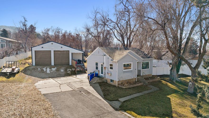 Grand Opening Saturday February 7th. 12:00-2:00pm.   A rare opportunity to own a full acre of horse property in Bountiful, where homestead charm meets the practicality of in-town living. The standout 40' x 40' garage with 12' x 12' doors offers incredible flexibility and space to bring your ideas to life. The expansive yard provides room for livestock, gardening, play, and more, while mature trees create a secluded, private feel. The home features 3 bedrooms, 2 bathrooms, and an updated kitchen. Don't miss this unique property.