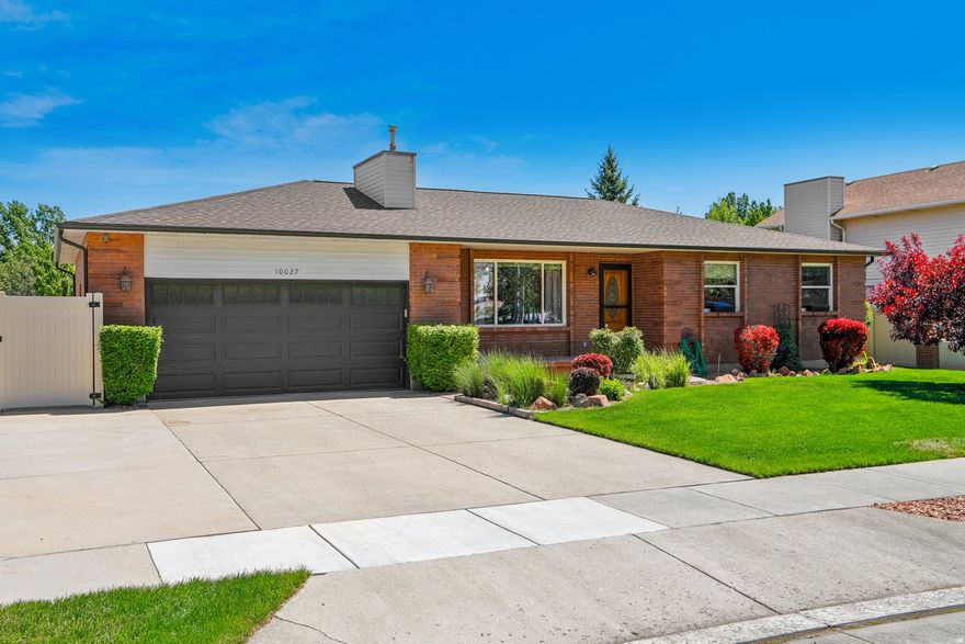 Beautifully maintained solid brick home featuring timeless 1980's construction known for durable craftsmanship. Thoughtfully updated with a newer roof (2021), updated kitchen, and all appliances replaced in 2023 - all included! Rambler style, main floor features three bedrooms, including a primary suite with updated ensuite bathroom, a rare find in homes of this era. The flexible basement layout includes a full ensuite bedroom with bathroom and a stubbed-in den area with strong potential for a kitchenette, guest suite, or in-law setup. An additional room with glass doors works well as an office or craft space and can be easily converted to a bedroom if desired. The spacious, fully fenced backyard is designed for comfort and low-maintenance living, offering a large lawn, garden beds, ceiling fans on the covered patio, and cleared rear landscaping with weed barrier and rock for long-term ease. A private rear gate provides potential direct access to the scenic Welby Jacob Canal Trail with addition of a bridge, plus trail access just 0.2 miles away at the end of Birnam Woods Way. Ideally located just outside Daybreak, this home offers quick access to shopping, dining, parks, trails, and highly regarded schools - all with NO HOA!