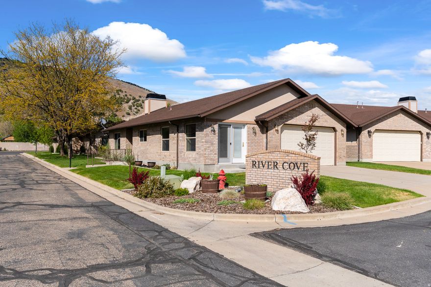Rarely available in the highly sought-after River Cove community, this beautifully maintained one-level living retreat offers comfort, convenience, and pride of ownership throughout. Standalone units like this are hard to find and rarely come on the market, giving you added privacy. (Other units are side-by-side). Perfectly situated in the heart of Morgan, you'll enjoy being within walking distance to downtown shops, the grocery store, parks, restaurants, and even the local bowling alley. Inside, the home features vaulted ceilings, an open-concept layout, and an inviting kitchen with a spacious dining area and cozy sitting room-ideal for entertaining or everyday living. The thoughtfully designed floor plan includes a large walk-in pantry, dedicated laundry room, and two additional bedrooms with a full bath, perfect for guests, hobbies, or a home office. The spacious primary suite features vaulted ceilings along with a separate tub and shower for a relaxing retreat. Enjoy truly maintenance-free living with the HOA covering exterior maintenance, lawn care, and snow removal. Upgrades include a large center island, stainless steel appliances, luxury vinyl plank flooring, and plantation shutters. Immaculately cared for and move-in ready, this home is the perfect blend of style, comfort, and convenience.